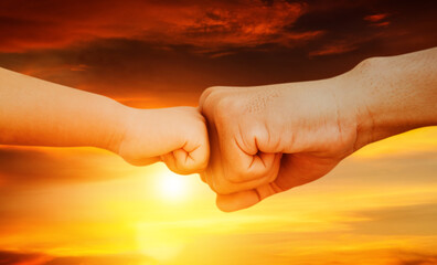 Plakat Image close up Father and son's hands touched with love in their fists : Teaching sons to be strong concept.