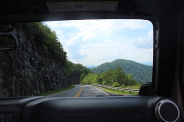 driving on a highway mountains jeep