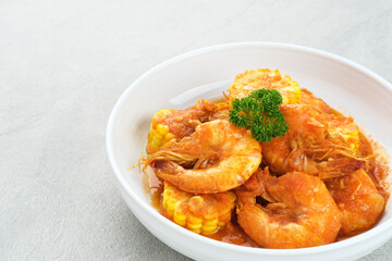 Udang Saus Padang (Shrimp in Chili Sauce), traditional food from Padang, Indonesia. Served in white bowl.
