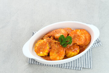 Udang Saus Padang (Shrimp in Chili Sauce), traditional food from Padang, Indonesia. Served in white bowl.
