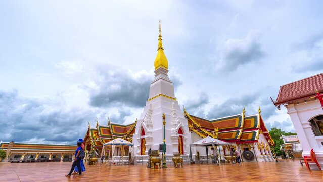 SAKON NAKHON,THAILAND- JULY 2,2022:Time lapse of Buddhists come to pay their respects at Wat Phra That Choeng Chum a major and sacred religious monument of Sakon Nakhon Province in Thailand.