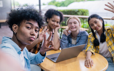 Portrait of teenage student using smartphone selfie say hi at high school or university. The group of happy fun teenager making selfie in classroom. Teamwork of cool kid  using computer to do project - Powered by Adobe