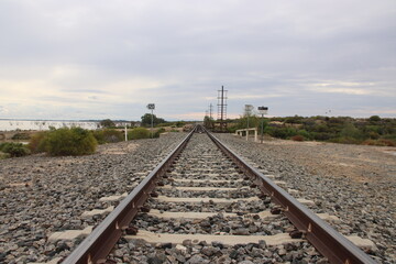 Fototapeta na wymiar Railway line passing the Menindee Lakes near Broken Hill, New South Wales, Australia.