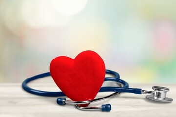 Red heart shape with doctor physician's stethoscope. World heart health day. doctor day, world...