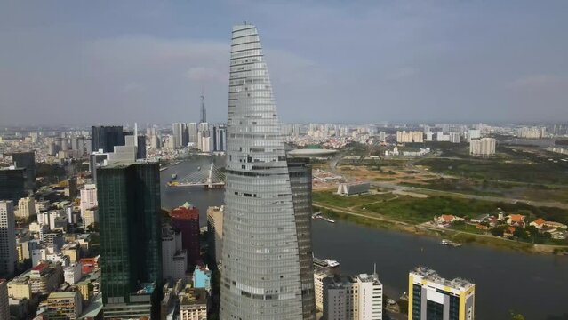 Ho Chi Minh, Vietnam. Aerial View of Bitexco Financial Tower and District 1 Riverfront Skyscrapers and Buildings, Drone Shot