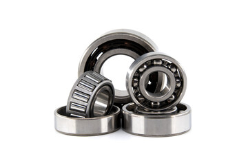 Group of various ball and roller bearings on white