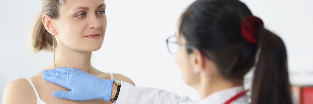 Blonde Female On Doctors Appointment Being Examined By Professional Medical Worker