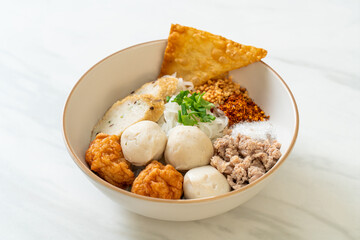 spicy small flat rice noodles with fish balls and shrimp balls without soup
