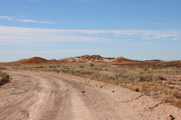 Dirt road in the Kanku-Breakaways Conservation Park near the remote outback opal mining town of Coober Pedy, South Australia.