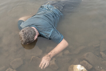 a dead man was found near the river, a dead man was drowned in a pond lake swamp