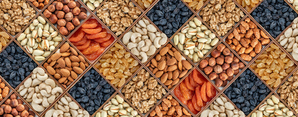 assorted nuts and dried fruit collection. Different superfoods. Vegetarian snack of different nuts. organic mixed nuts background. wide banner