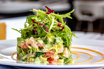 Layer Salad with Shrimps, Crab and Avocado in Luxury Restaurant