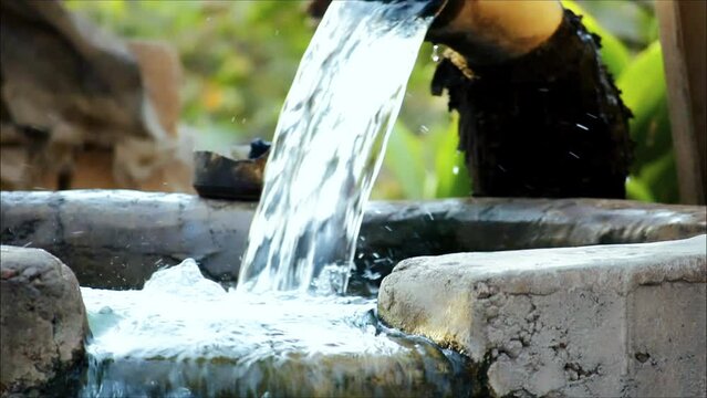 close up view pump pipe water flow equipment agriculture,water flowing to tap in the big water tank, tubewell - freshwate