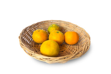Orange and grapefruit (Citrus maxima) fruits in separate basket on white background.