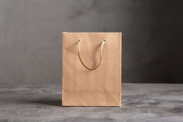 Blank paper carrier bag with handles for shopping - disposable bag, recycling concept