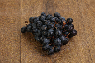 Purple grape branch over background