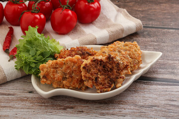 Fried salmonn cutlet in the bowl