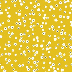 Simple vintage pattern. Small white flowers. Yellow background. Fashionable print for textiles and wallpaper.