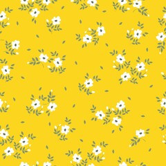 Fototapeta na wymiar Simple vintage pattern. Small white flowers and green leaves. Yellow background. Fashionable print for textiles and wallpaper.