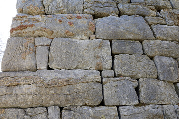 Stone wall remnants with polygonal masonry of ancient Amos town in Turkey founded by the Dorians in the VII century BC
