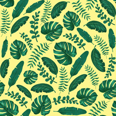 Seamless background with leaves of tropical plants