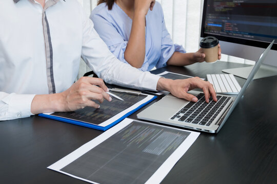 Team of programmers working with computer programming, professional development, and coding technology, working on high-quality visual software development websites