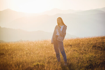 Happy Teen Girl in Golden Mountain Sunrise Landscape