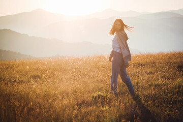 Pretty Teen Girl in Golden Mountain Sunrise Landscape