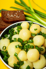Concept of tasty food with boiled young potatoes