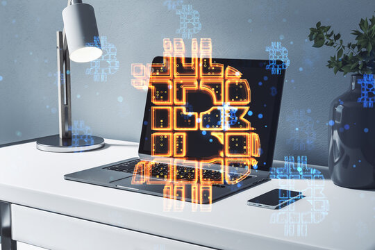 Cryptocurrency concept with orange glowing digital bitcoin sign on modern laptop on white office table background, double exposure