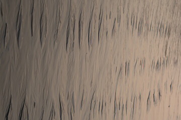 Stunning view of wet sand patterns at the beach