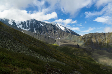 Naklejka premium View over a snowy and rocky mountain range of Altai on the way to Karaturek Pass which leads to Belukha mountain. Altai mountains, Siberia, Russia