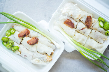 Two box of crab fresh spring rolls for eating with sweet sauce in white box