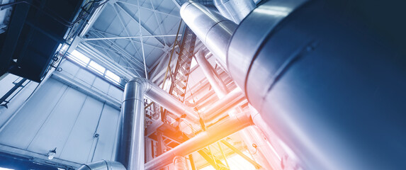 Industrial concept background blue toning. Steel pipelines, valves gas and oil refinery plant...