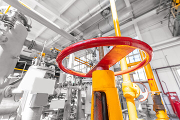 Background industrial, red valve blocking gas in pipeline, blue toning