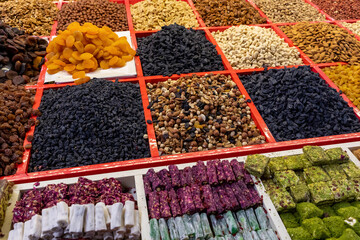 Traditional Azerbaijani cuisine ingredients dried fruit and herbs at the local market in Baku,...