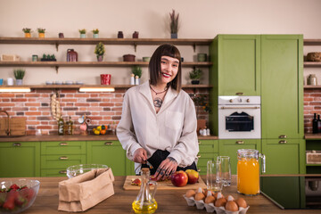 Portrait of young beautiful woman on kitchen