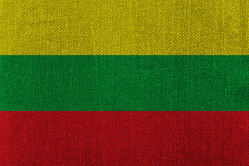Patriotic classic denim background in colors of national flag. Lithuania
