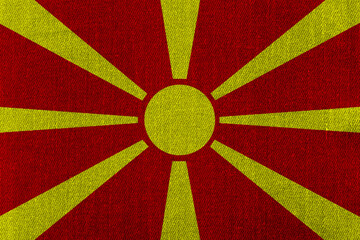 Patriotic classic denim background in colors of national flag. Macedonia