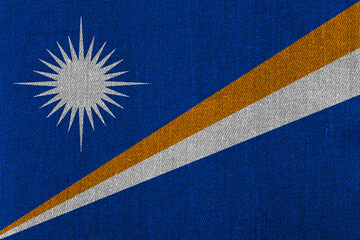 Patriotic classic denim background in colors of national flag. Marshall Islands
