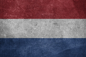 Old leather shabby background in colors of national flag. Netherlands
