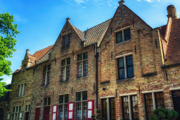 Fototapeta premium Several historical red houses in Bruges, Belgium