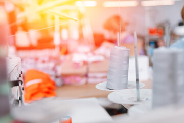 Obraz na płótnie Canvas Banner photo industry interior of garment factory with sew machine sunlight