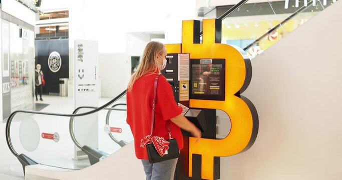 Girl near the payment terminal