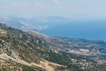 Fototapeta na wymiar Aerial view over Ionian Mediterranean sea coast landscape of Southern Albania view from top of Llogora mountain national park. Albania