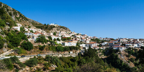 Fototapeta na wymiar Coastal village of Dhermi with white houses on the slope of mountains. Albania