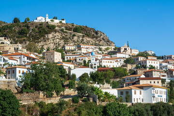 Coastal village of Dhermi with white houses on the slope of mountains. Albania