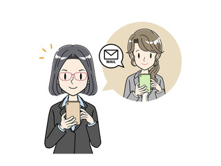 スマホでメールのやりとりをするスーツのビジネスパーソン