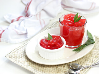 Manisan Kolang-Kaling, or preserved sugar palm fruit, tinted red, a traditional Indonesian typical refreshment and dessert during Ramadan month and in Idul Fitri or Hari Raya. Selective focus