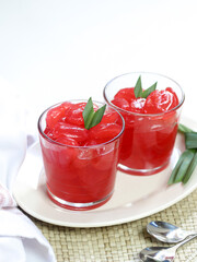 Manisan Kolang-Kaling, or preserved sugar palm fruit, tinted red, a traditional Indonesian typical refreshment and dessert during Ramadan month and in Idul Fitri or Hari Raya. Selective focus